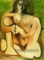 Femme nue accroupie sur fond vert 1960 Cubisme